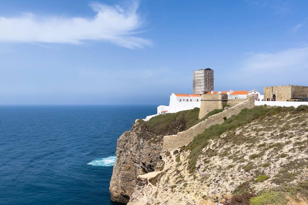 View of historic lighthouse on top of the cliffs of Cabo de Sao Vicente