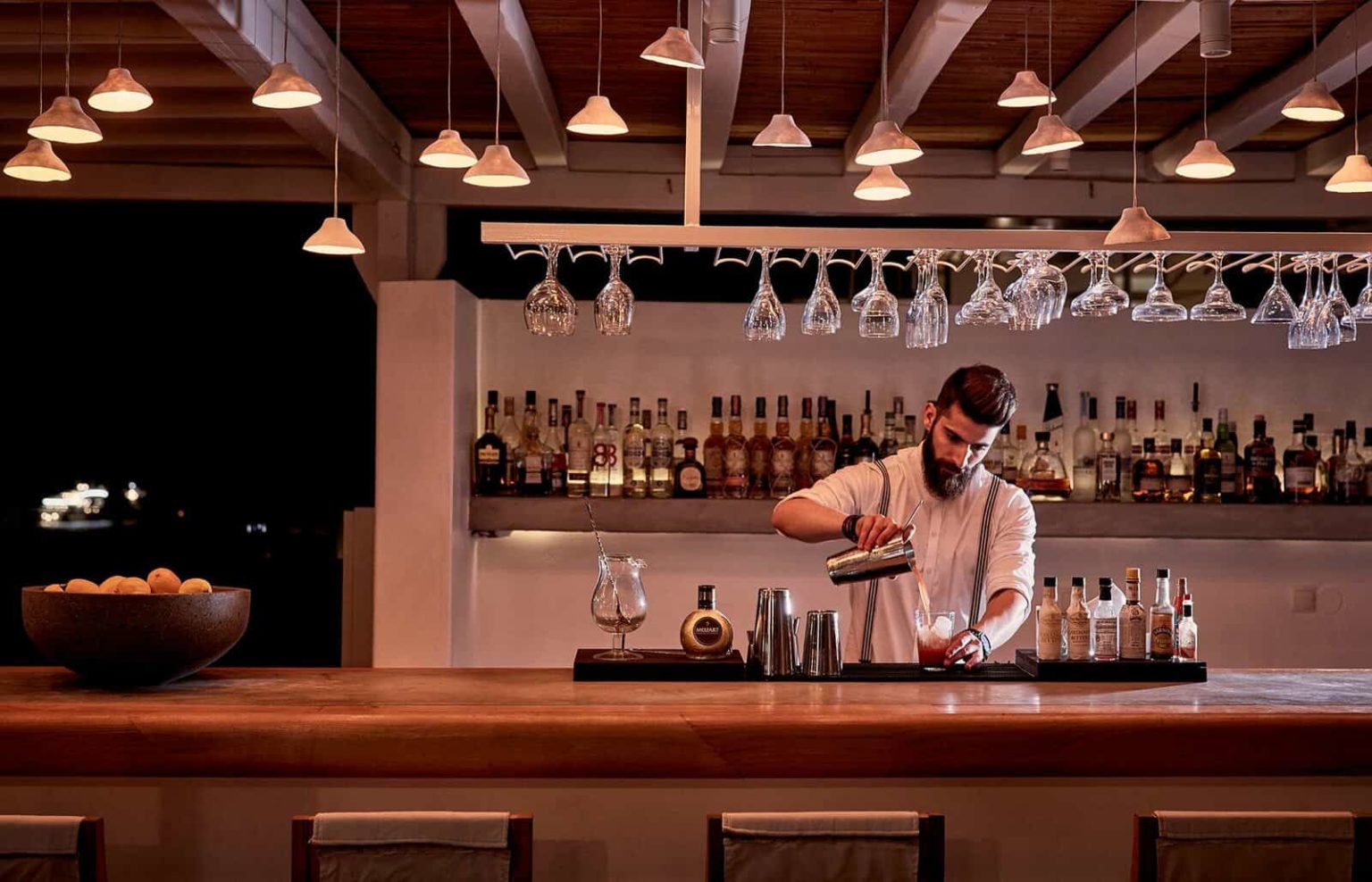 Bartender creating a mixed cocktail at Bilo Bar - Boheme Mykonos
