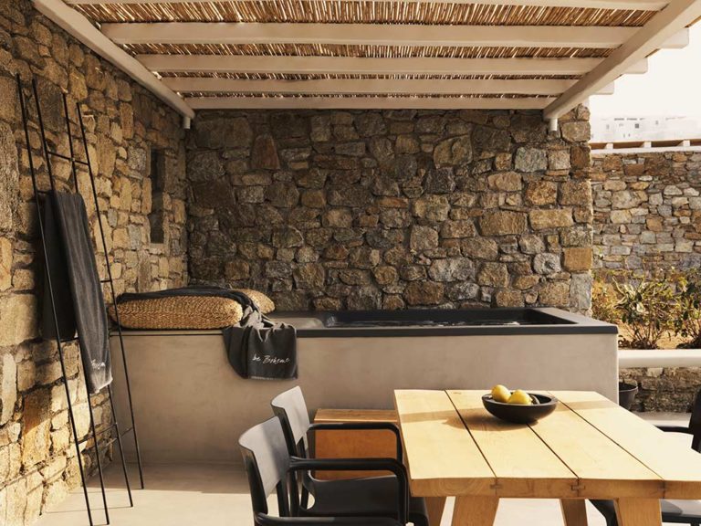 Boheme Mykonos - Honeymoon Suite covered terrace with dining table and jacuzzi