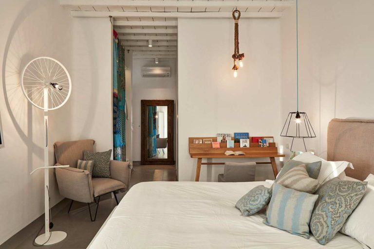 Boheme Mykonos - Sea View Suite bed, sitting area, and workspace