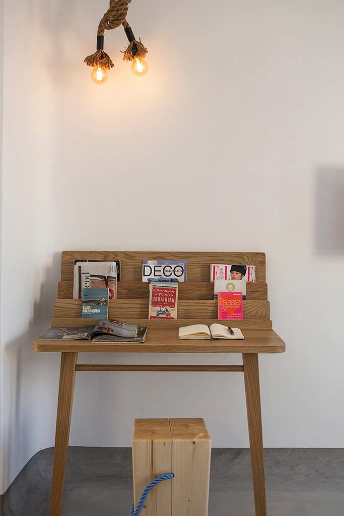 Boheme Mykonos - Sea View Suite workspace topped with reading materials