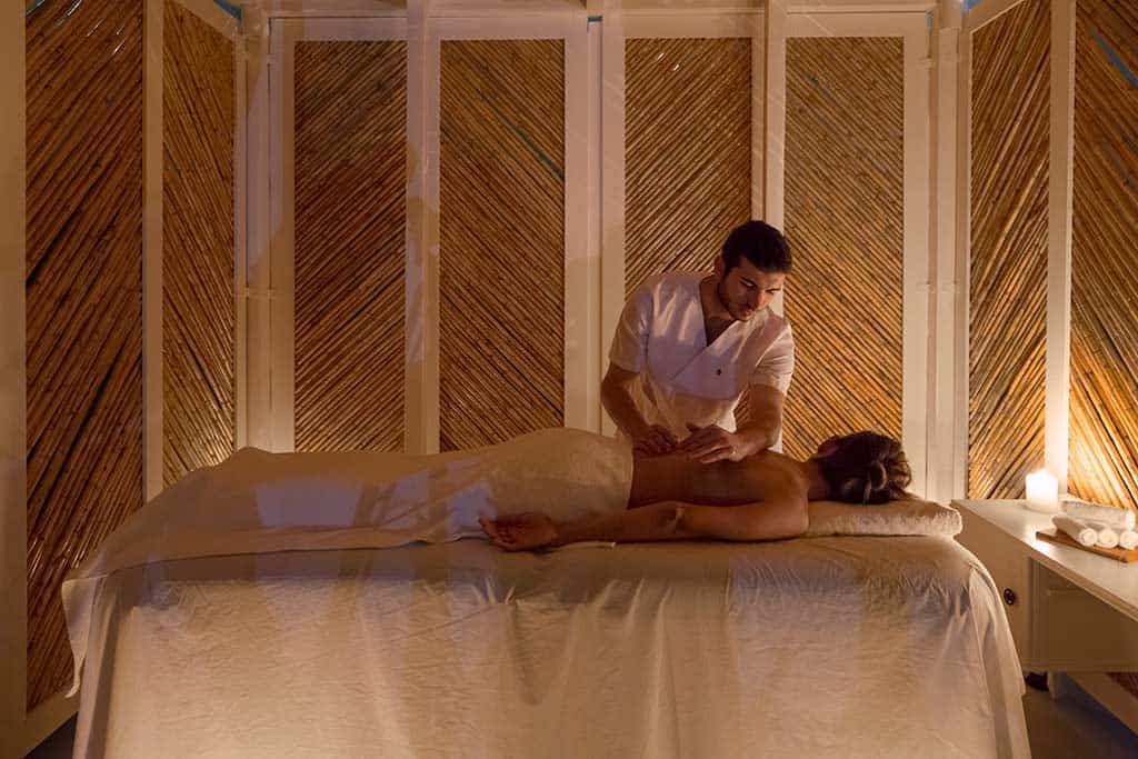 Woman receiving a back massage at the Spa - Boheme Mykonos