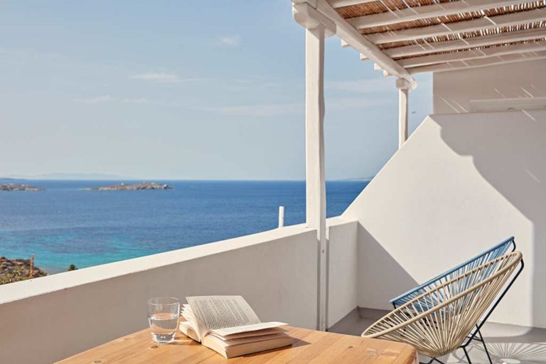 Boheme Mykonos - Superior Sea View Suite private terrace with table and chairs