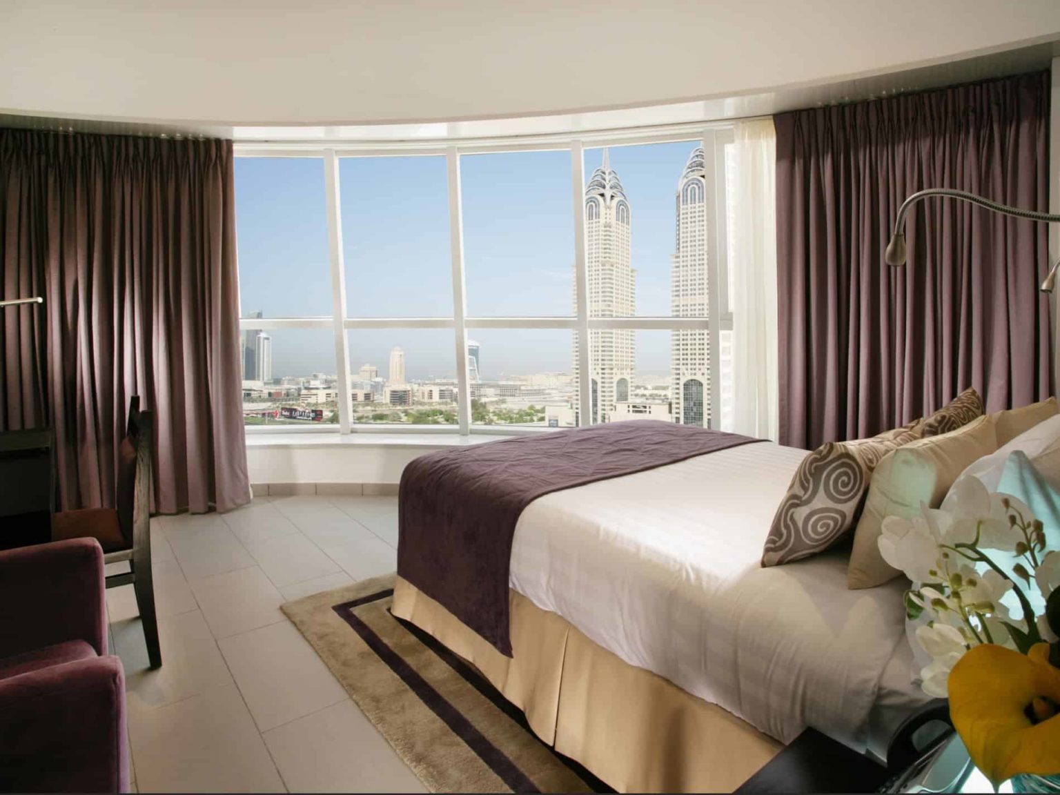 Citadines Metro Central Dubai bedroom suite overlooking the city