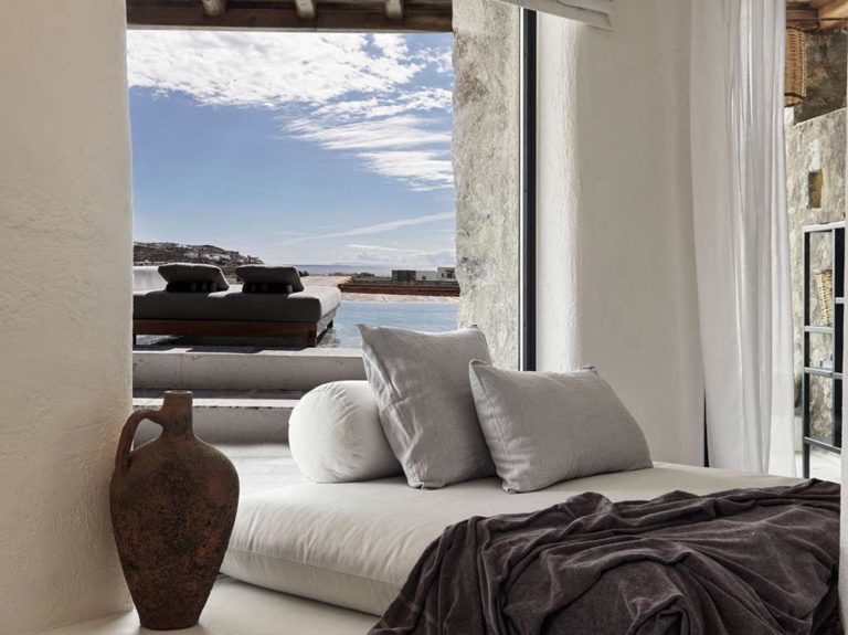 Nomad Mykonos - Nomad Suite Sea View daybed overlooking the outdoor pool