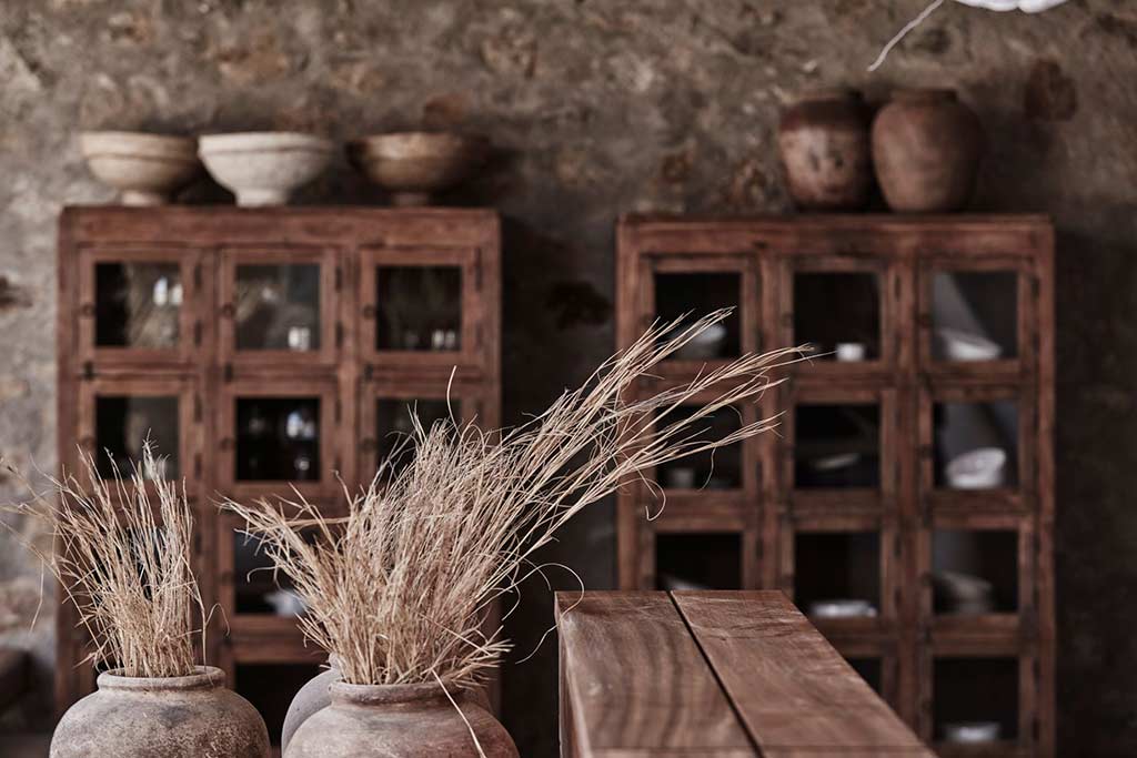 Rustic decor and handmade pottery at Nomad Mykonos