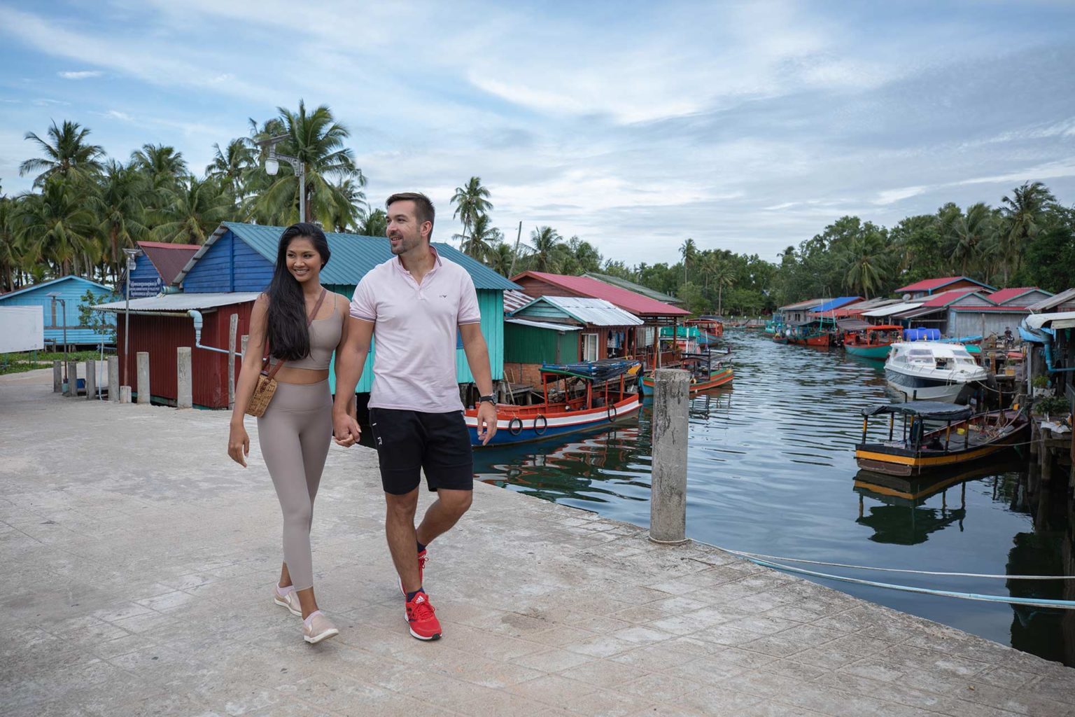 Couple walking in a village in Koh Rong