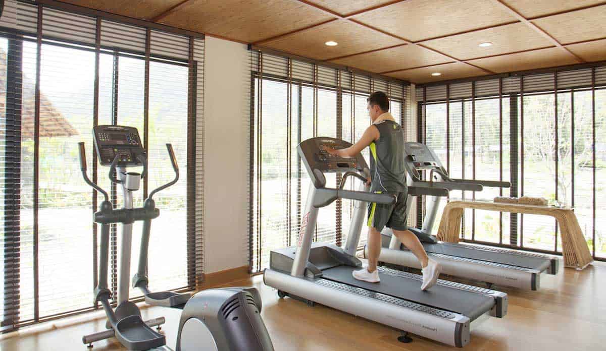Man walking on a treadmill at the Royal Sands Koh Rong fitness center