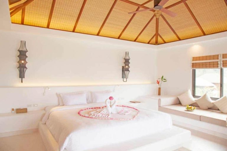 Ocean View Pool Villa bedroom with king size bed and sitting area at the Royal Sands Koh Rong