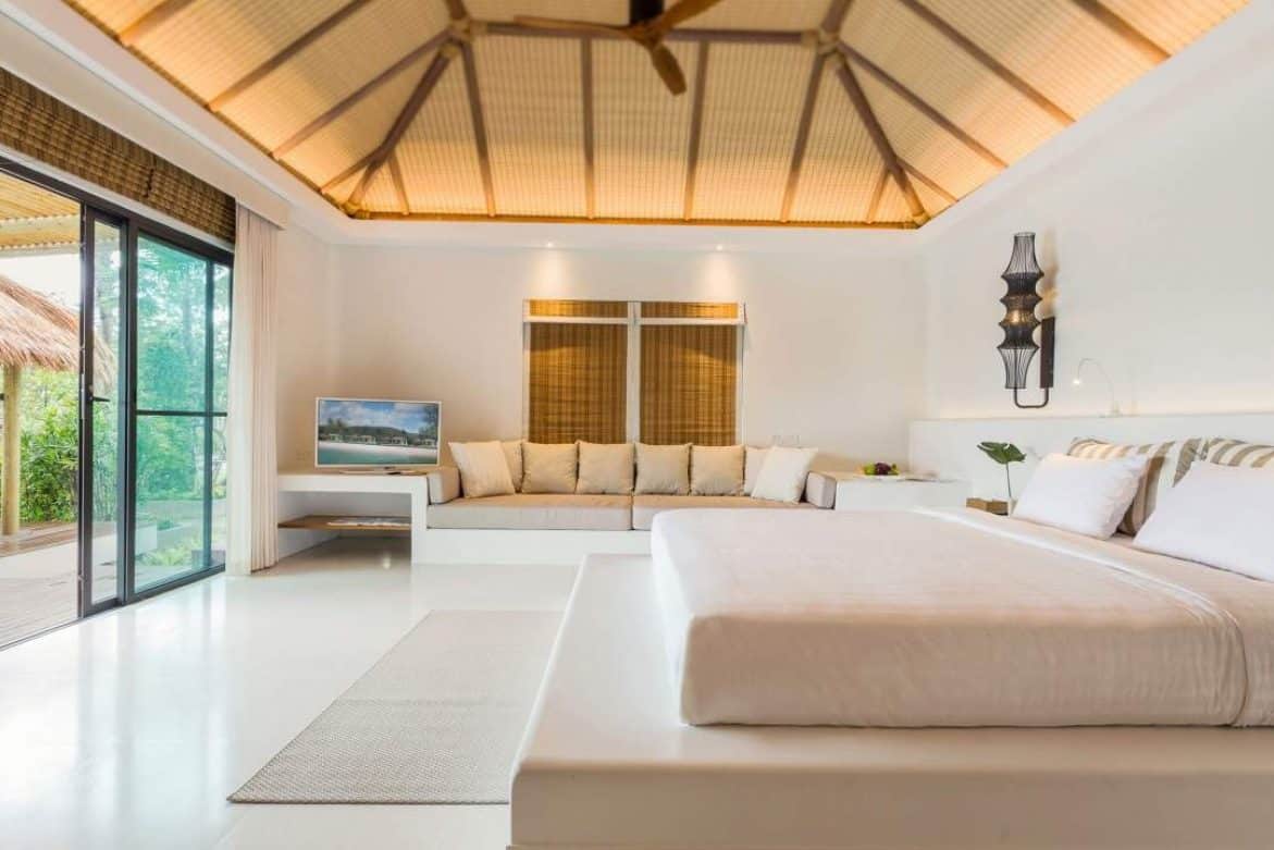Ocean View Villa bedroom with king size bed and sitting area at the Royal Sands Koh Rong