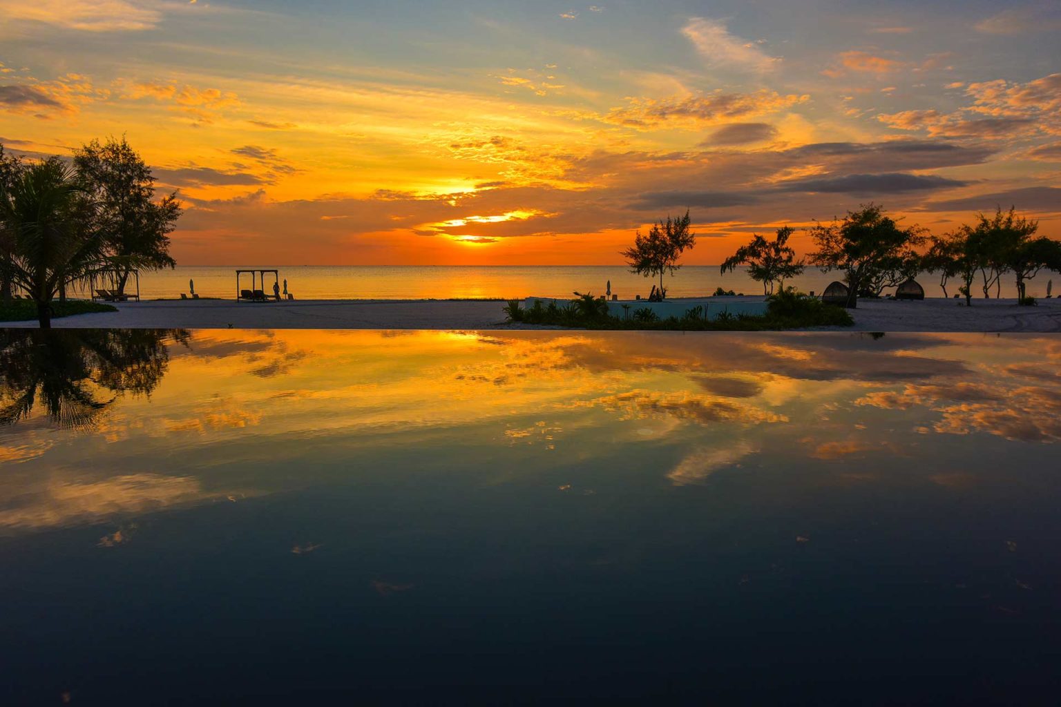 Sunset over the infinity pool at the Royal Sands Koh Rong