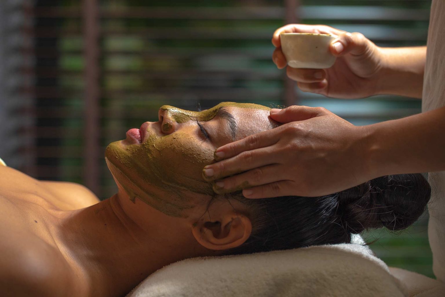 Woman receiving a facial at the spa | Royal Sands Koh Rong