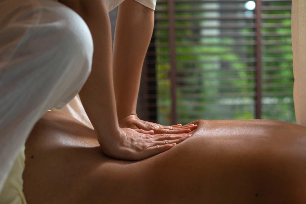 Woman receiving a back massage at the Royal Sands Koh Rong