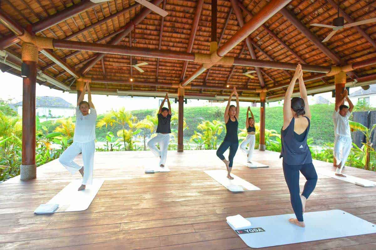 Group outdoor yoga class at the Royal Sands Koh Rong