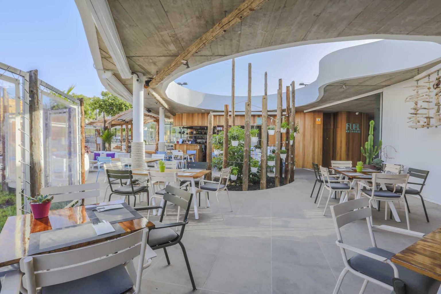 Fuel Restobar courtyard outdoor tables and chairs | Baobab Suites
