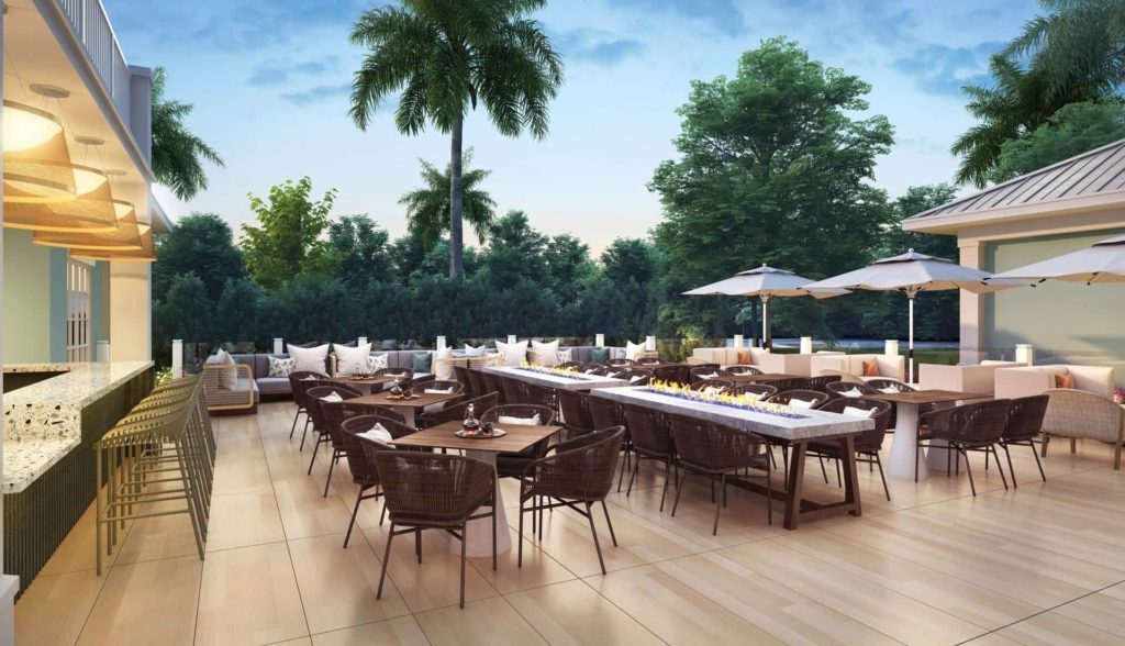 Outdoor dining deck at Embassy Suites by Hilton Orlando Sunset Walk