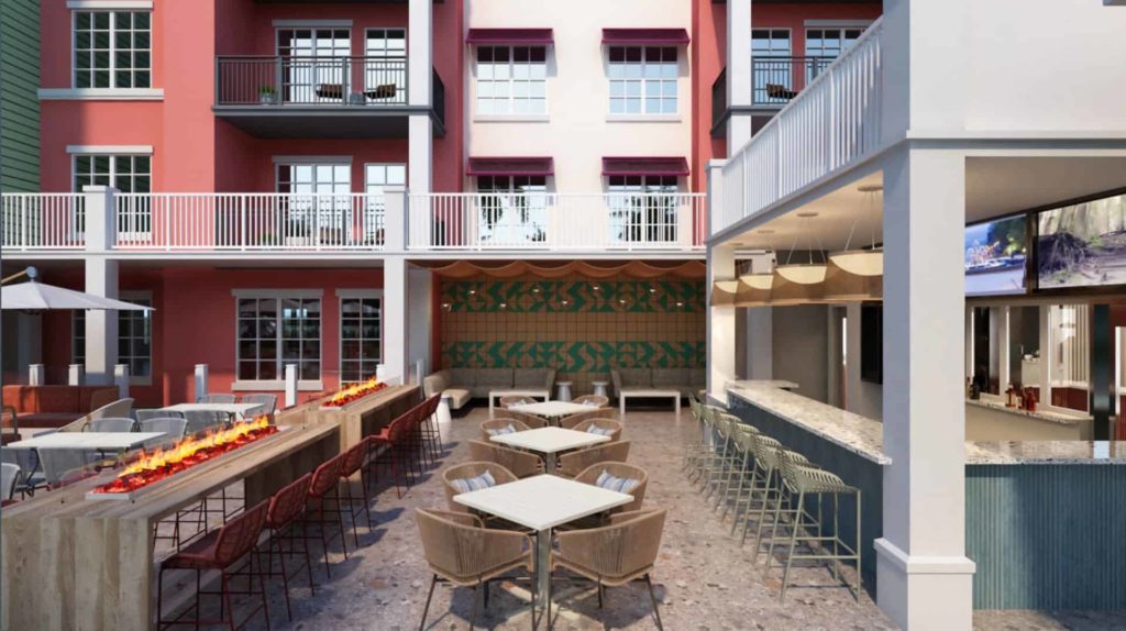Outdoor dining area and bar at Embassy Suites by Hilton Orlando Sunset Walk