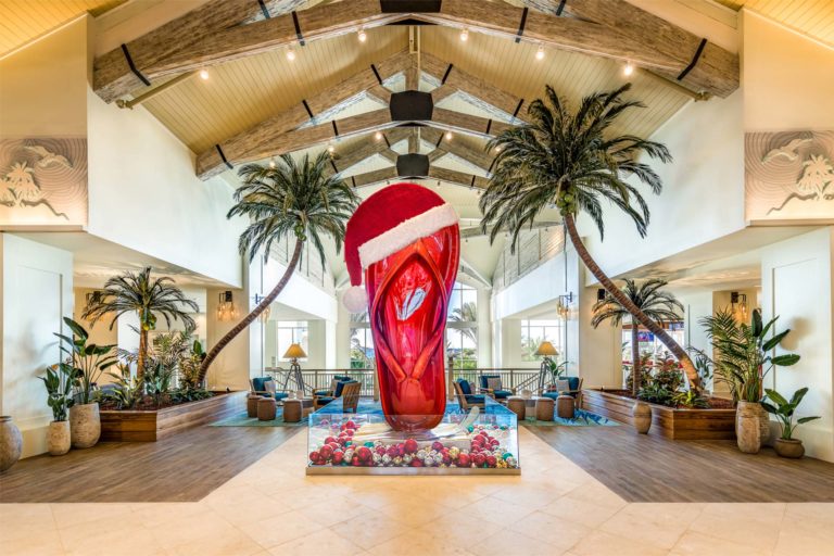 Santa Claus hat on top of Margaritaville Resort Orlando’s giant flip flop sculpture.