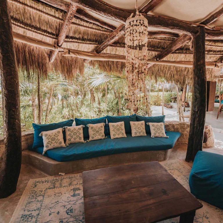 Casa Viento - covered patio with lounge sitting area at the Papaya Playa Project