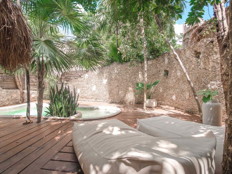 Casita jungle view with lounge chairs at the Papaya Playa Project