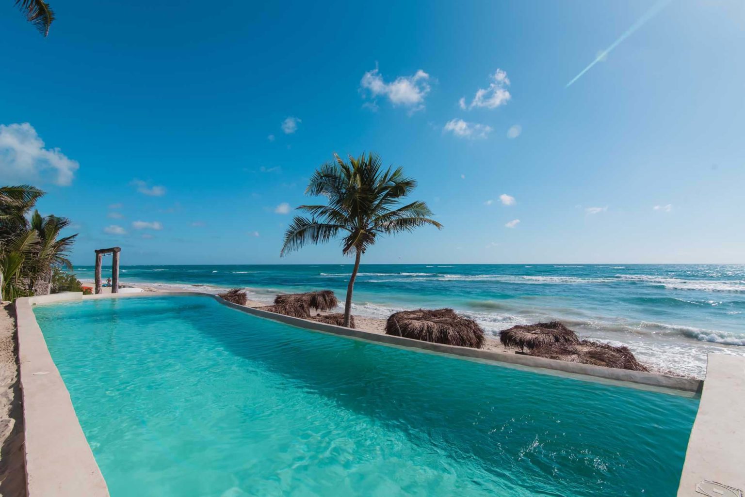 Infinity pool overlooking the beach at the Papaya Playa Project