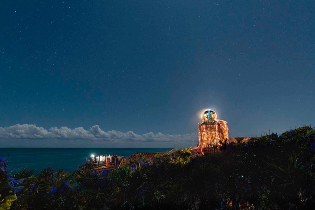 Nighttime view of Star Collector art installation at the Papaya Playa Project