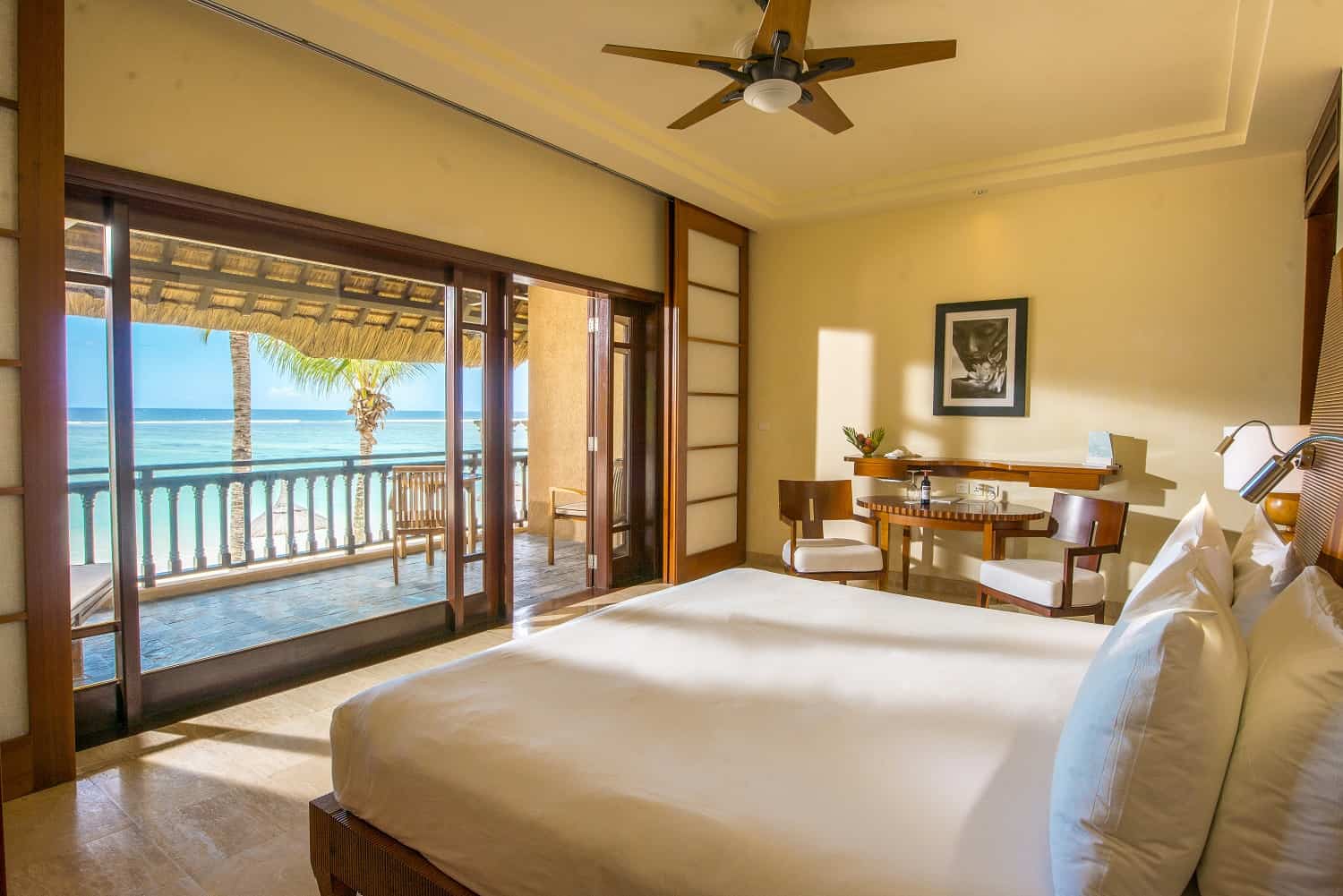 Oceanfront junior suite with balcony overlooking the ocean at Shanti Maurice Resort & Spa.