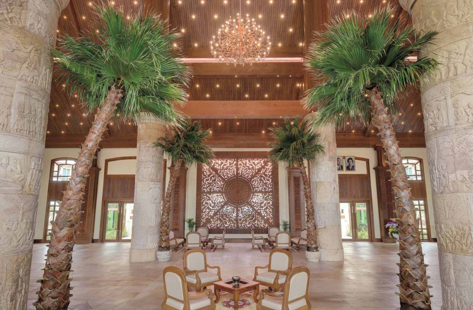 Sokha Siem Reap Resort lobby with high ceilings, seating areas and palm trees