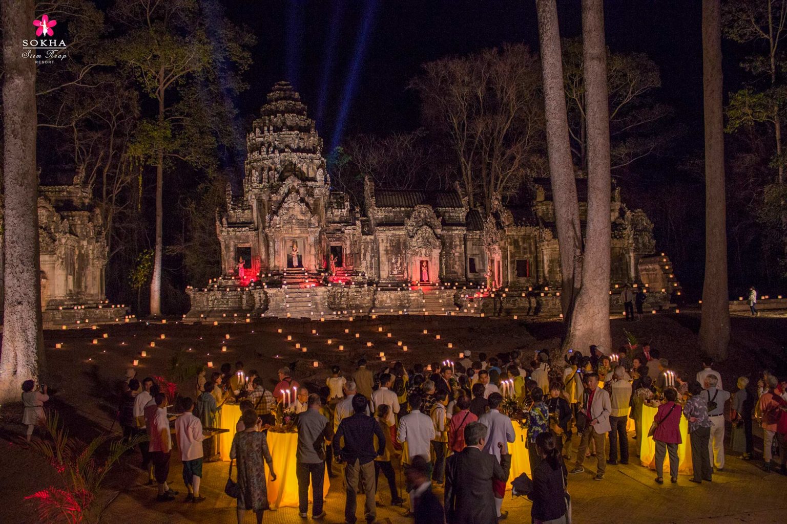 Large group of people attending a dinner outside of a historic temple near the Sokha Siem Reap Resort