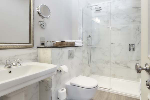 Classic Room - Bathroom with shower, toilet, and pedestal sink | Bovey Castle