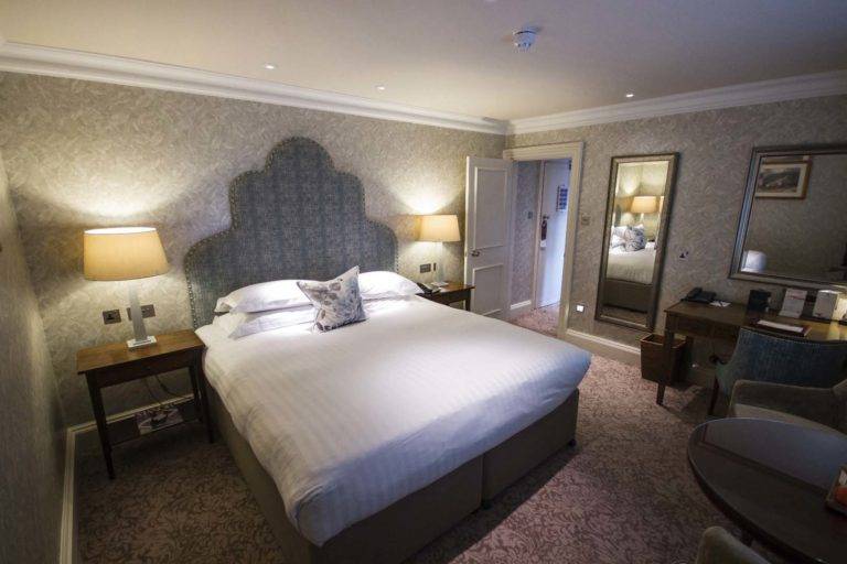 Classic Room - Bedroom with king bed, sitting area, and workstation | Bovey Castle