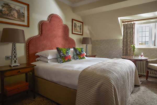 Classic Room - Bedroom with king bed and sitting area | Bovey Castle