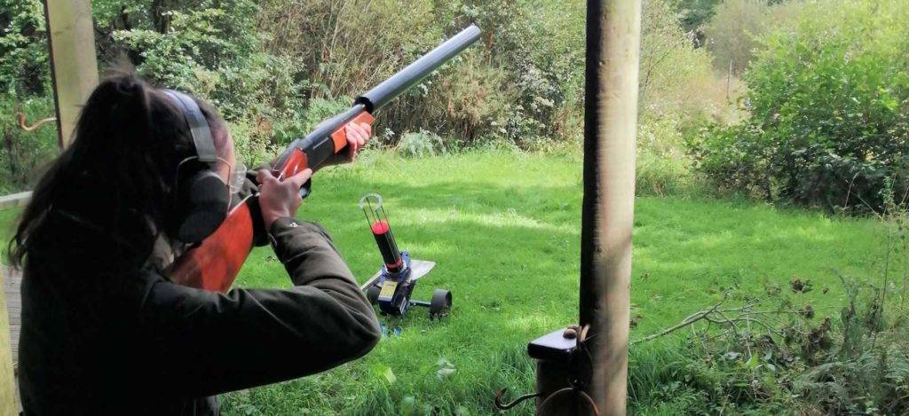 Woman shooting clay pigeons at Bovey Castle