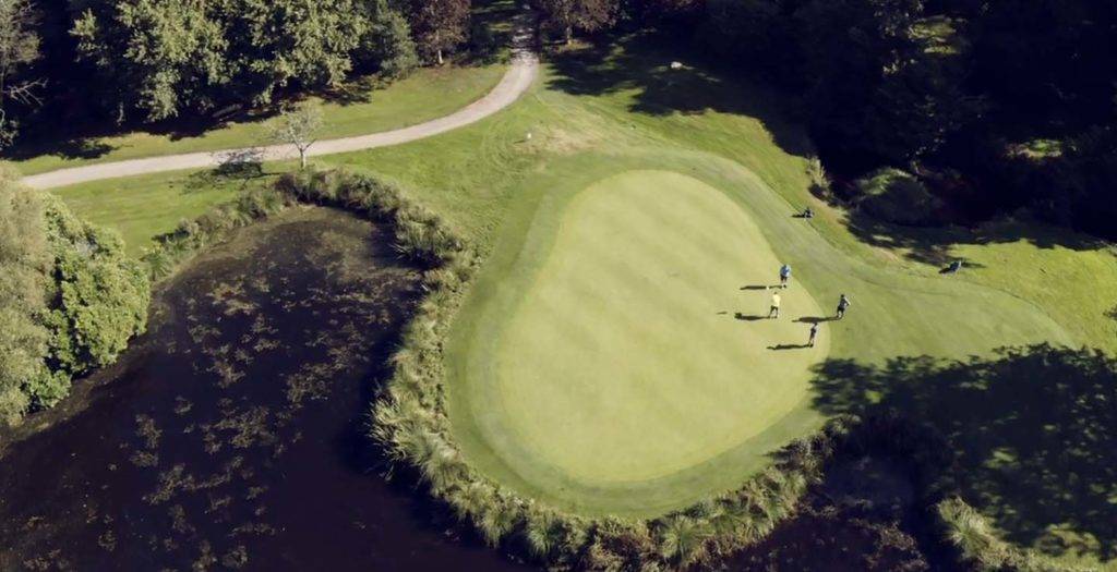 Aerial view of people playing a round of golf at the Bovey Castle Golf Course