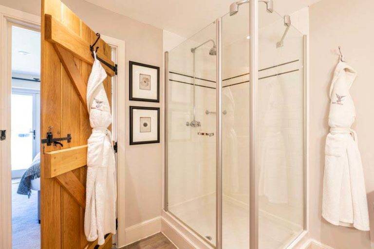 Castle Lodge - Bathroom with shower and hanging bathrobes | Bovey Castle