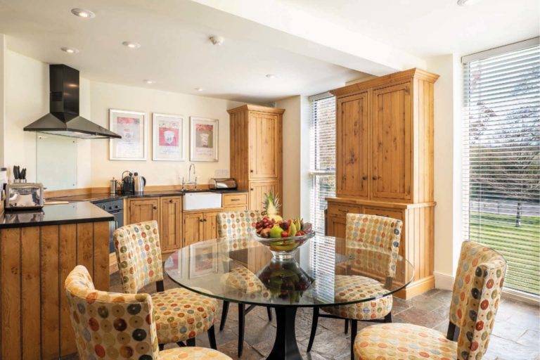 Castle Lodge - Eat-in kitchen with natural wood cabinets | Bovey Castle