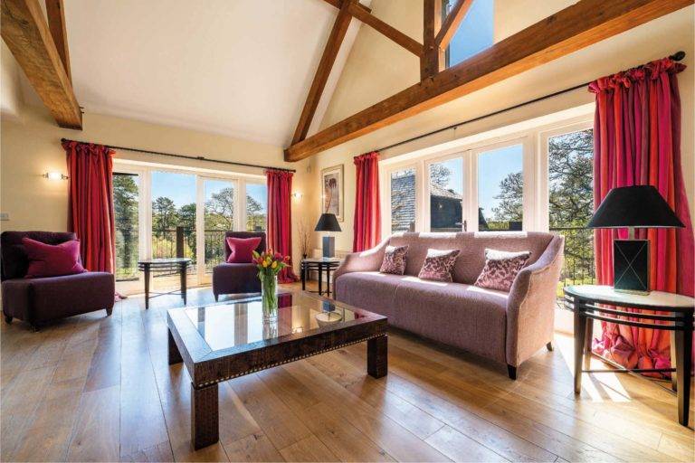 Castle Lodge - Open living room with comfortable furniture and exposed wood beams | Bovey Castle