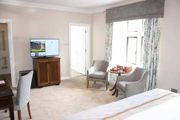 Mews Room - King bedroom with sitting area, workstation, and TV | Bovey Castle