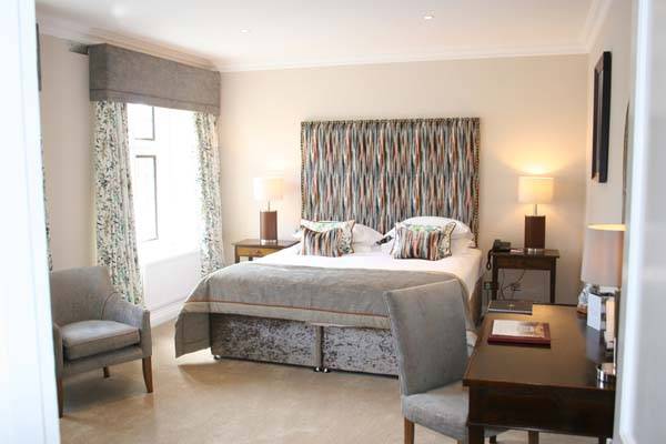 Mews Room - King bedroom with sitting area and workstation | Bovey Castle