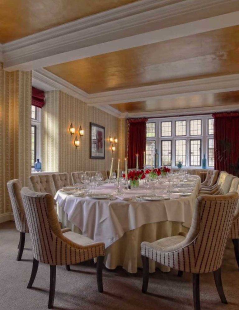 Large, set dining table in a private dining room at Bovey Castle