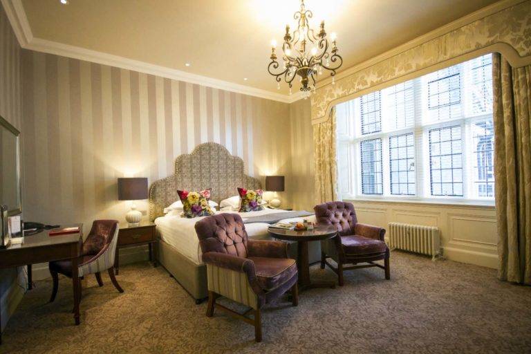 Castle Room - Bedroom with king bed, sitting area, and workstation | Bovey Castle