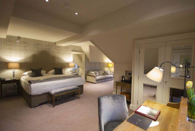 State Room - Bedroom with king bed, sitting area, and workstation | Bovey Castle