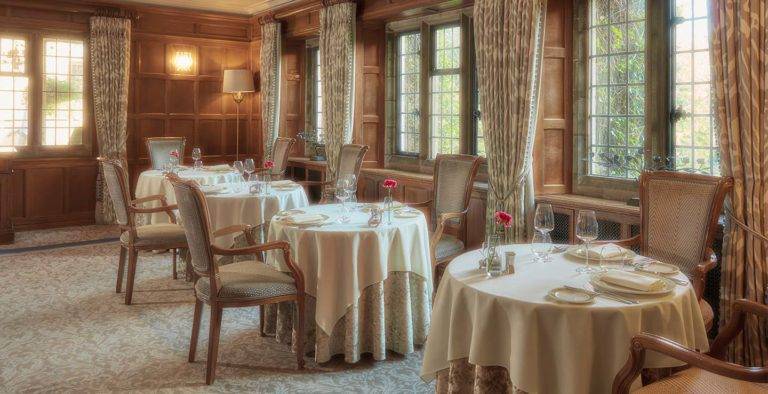 Traditional style restaurant tables and chairs at the Mallory Court Dining Room