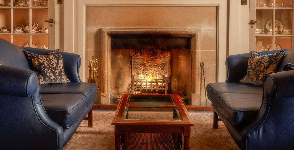 Mallory Court lounge area with comfortable seating area and fireplace