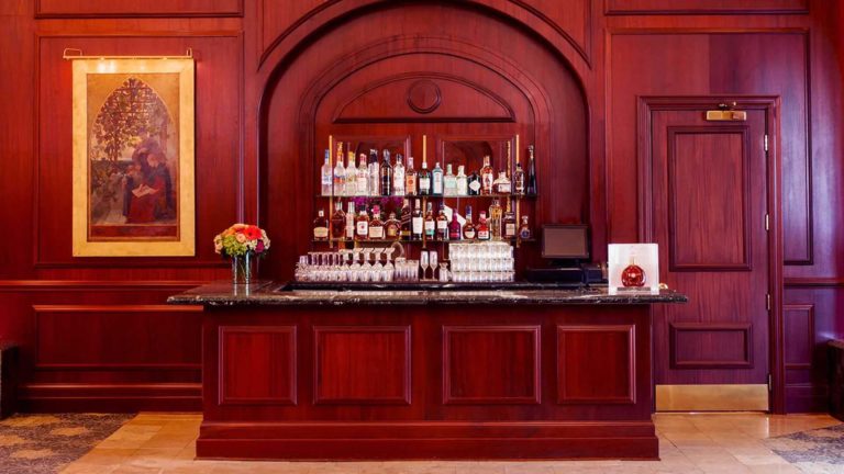 Lobby Bar - Bar stocked with liquor varieties and cocktail glasses | Nemacolin
