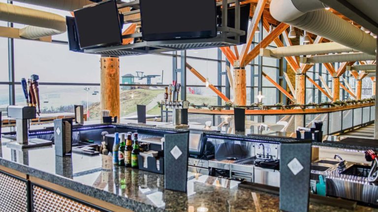 The Peak - Modern bar with menus and mounted TVs | Nemacolin
