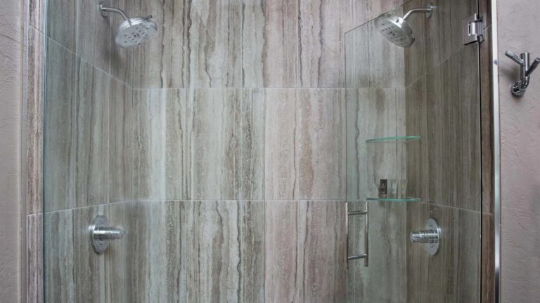 The Estates Dogwood - Bathroom shower with stone tile and 2 shower heads | Nemacolin