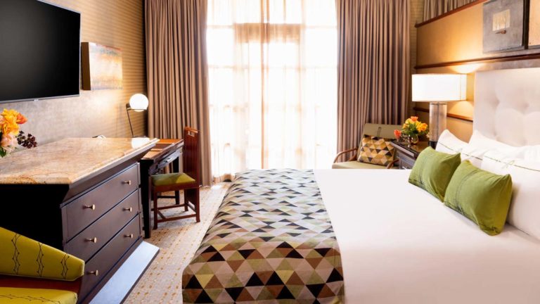 Falling Rock King Suite - Contemporary style room with king bed, sitting area, workstation, and TV | Nemacolin