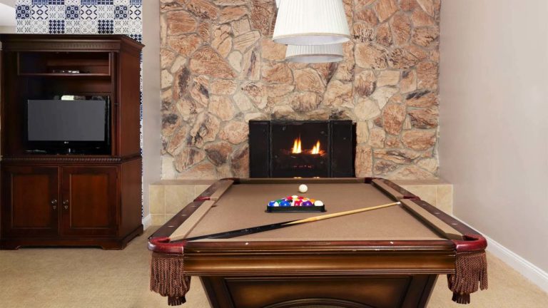 The Homes Garshak - Game room with fireplace and pool table | Nemacolin