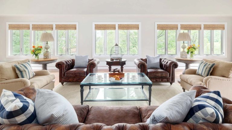 The Homes Garshak - Large living room with comfy seating and lots of windows | Nemacolin